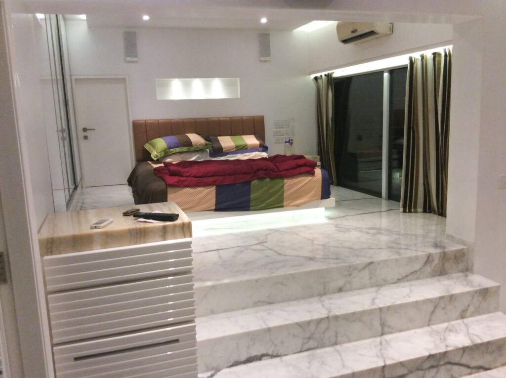 Automated bachelor's room with a private home theatre and motorised shades in Upper Santacruz, Mumbai
