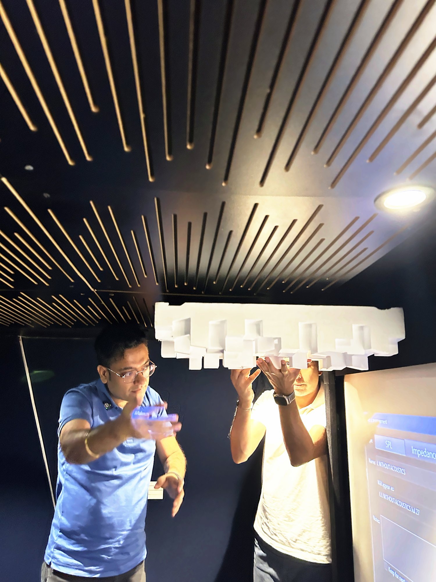 Participants testing diffuser placement in a studio