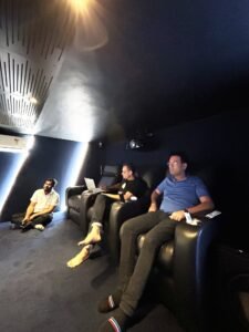 Participants listening from the seats in a theatre room