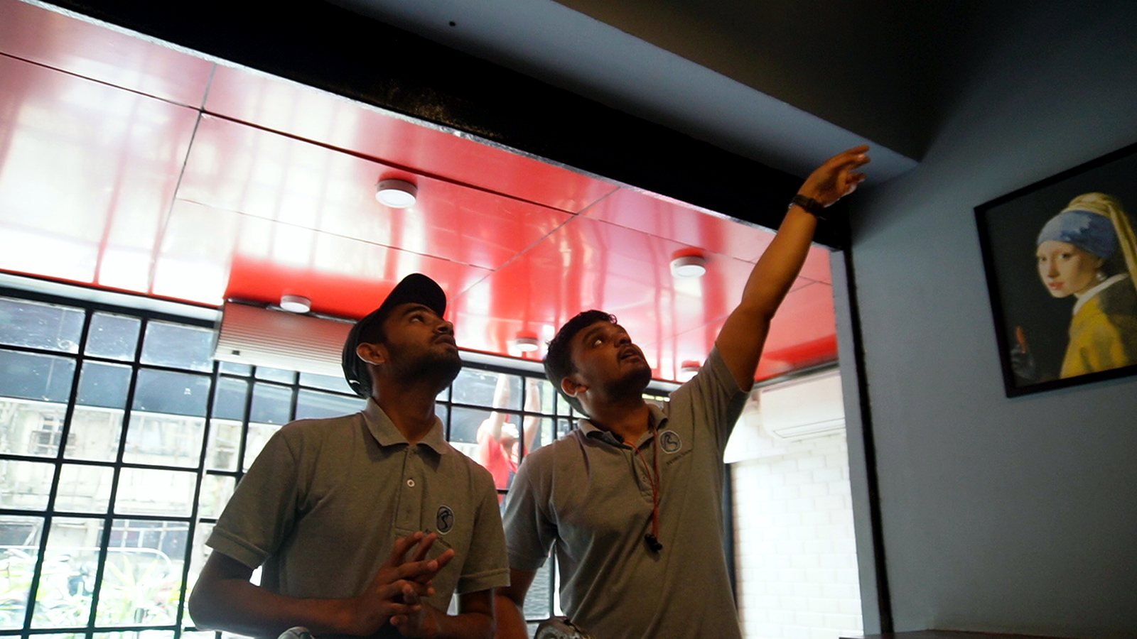 Avenue Sound team positioning speakers in a Bandra restaurant