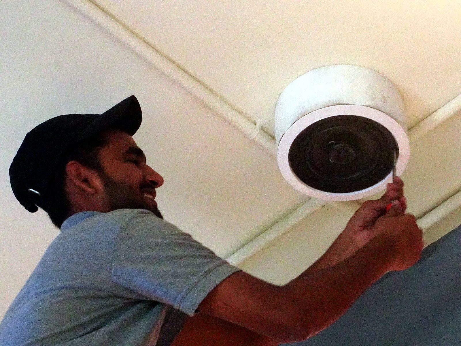 Installing a ceiling speaker in a Bandra restaurant