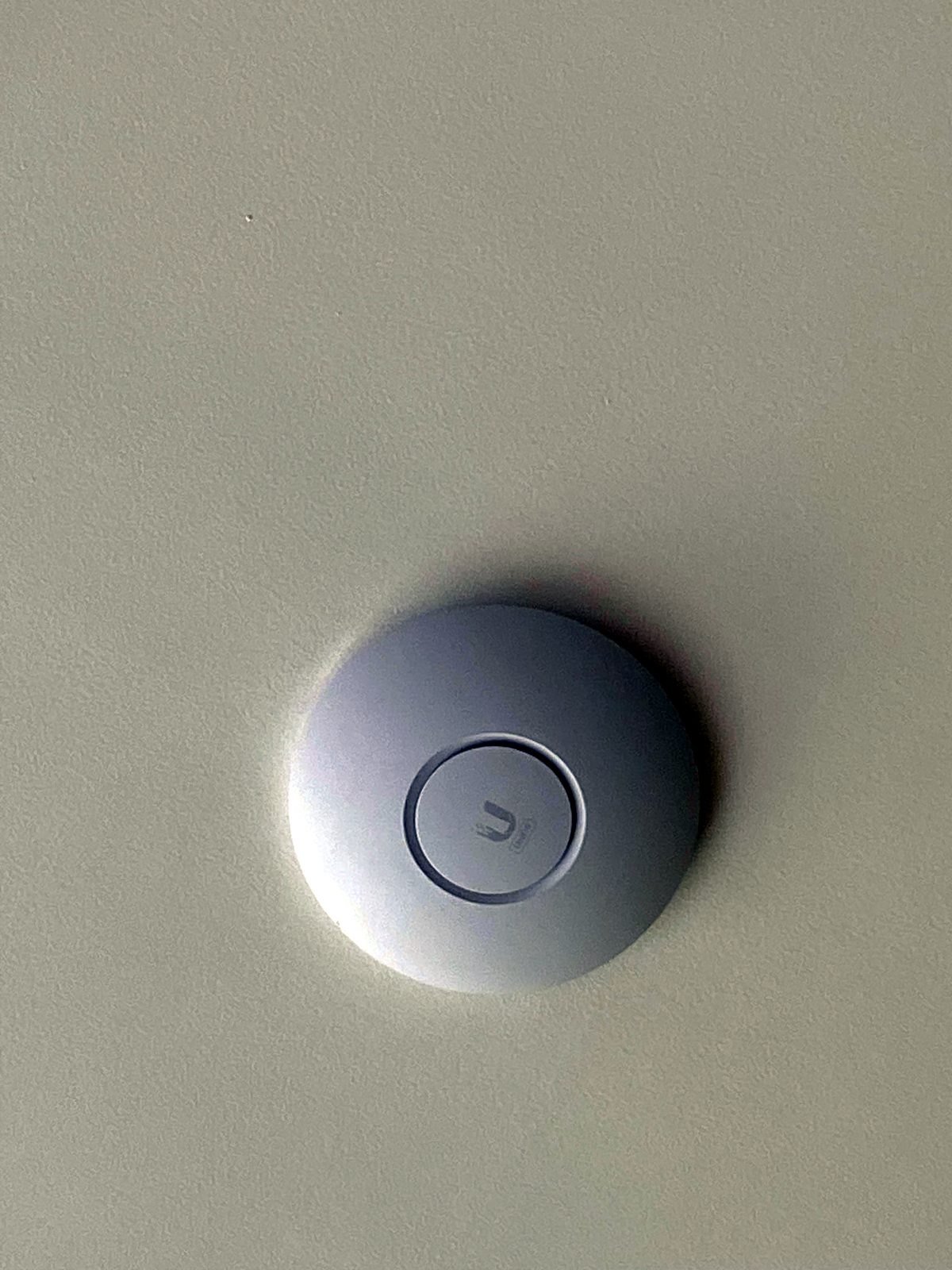 Ceiling-mounted Wi-Fi access point in a smart home in Bandra