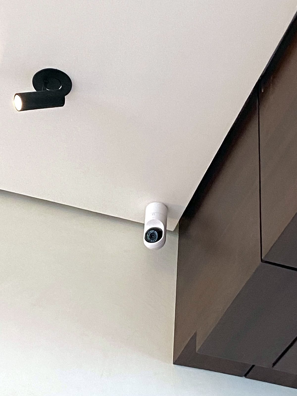 Ceiling-mounted camera in the corridor of a Bandra smart apartment