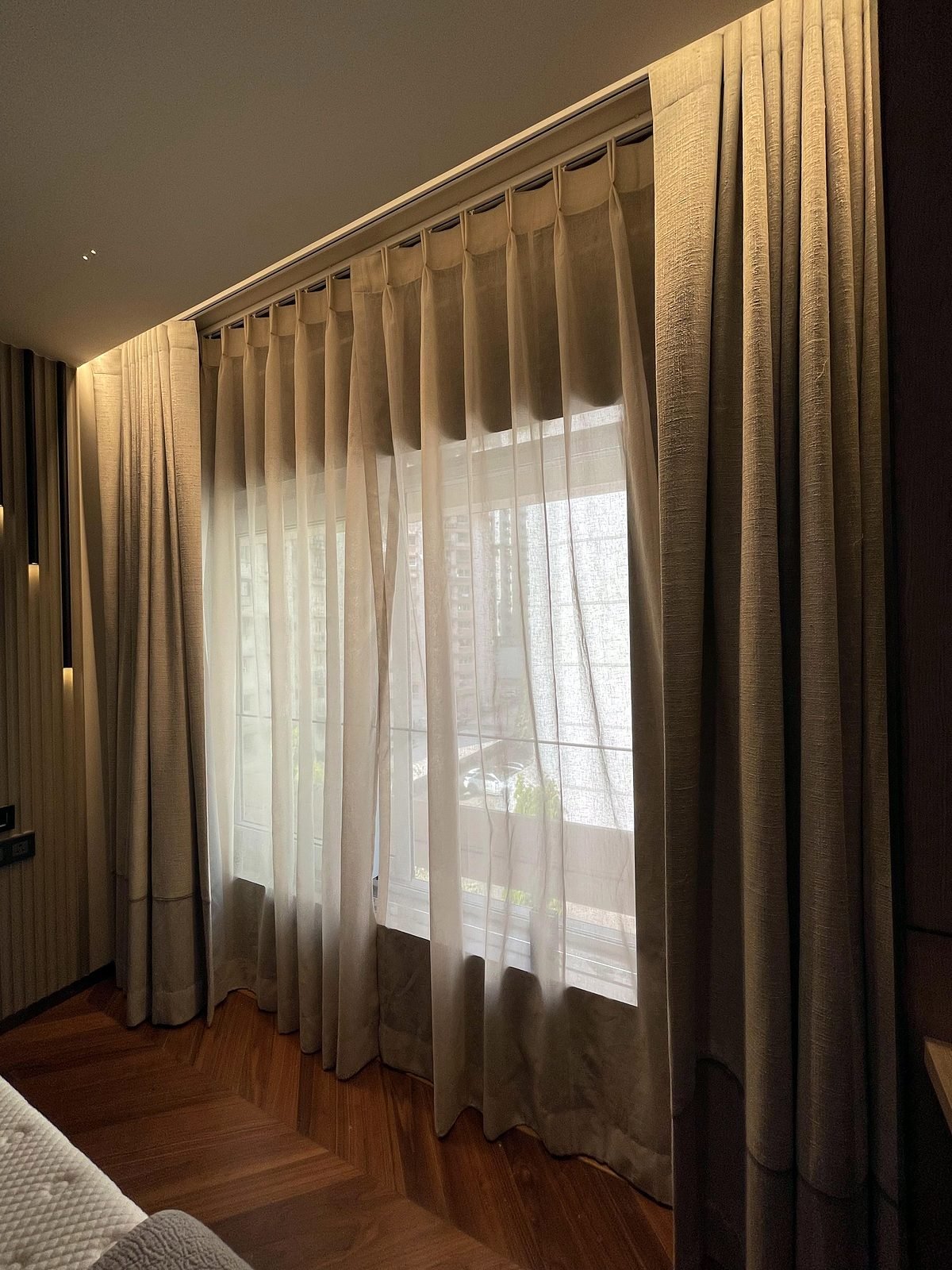 Floor-to-ceiling main and sheer curtains in a Cuffe Parade apartment