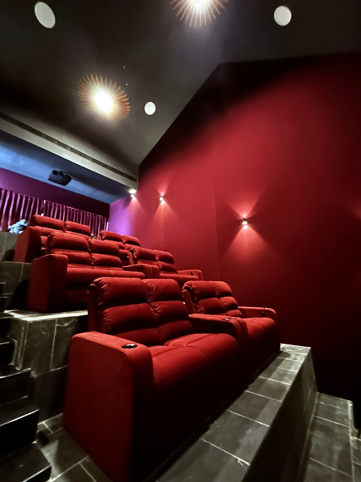 Tiered seating in a dedicated home theatre in Goa