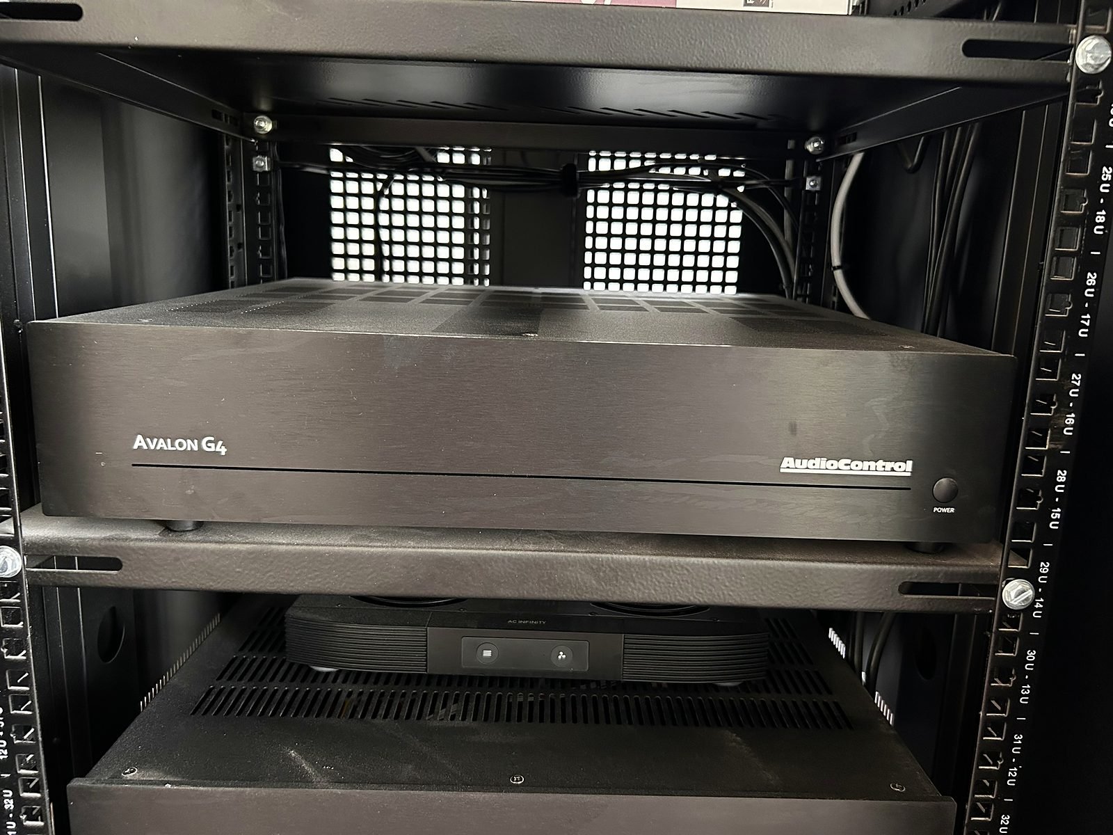 AudioControl amplifiers in the equipment rack of a Goa home theatre