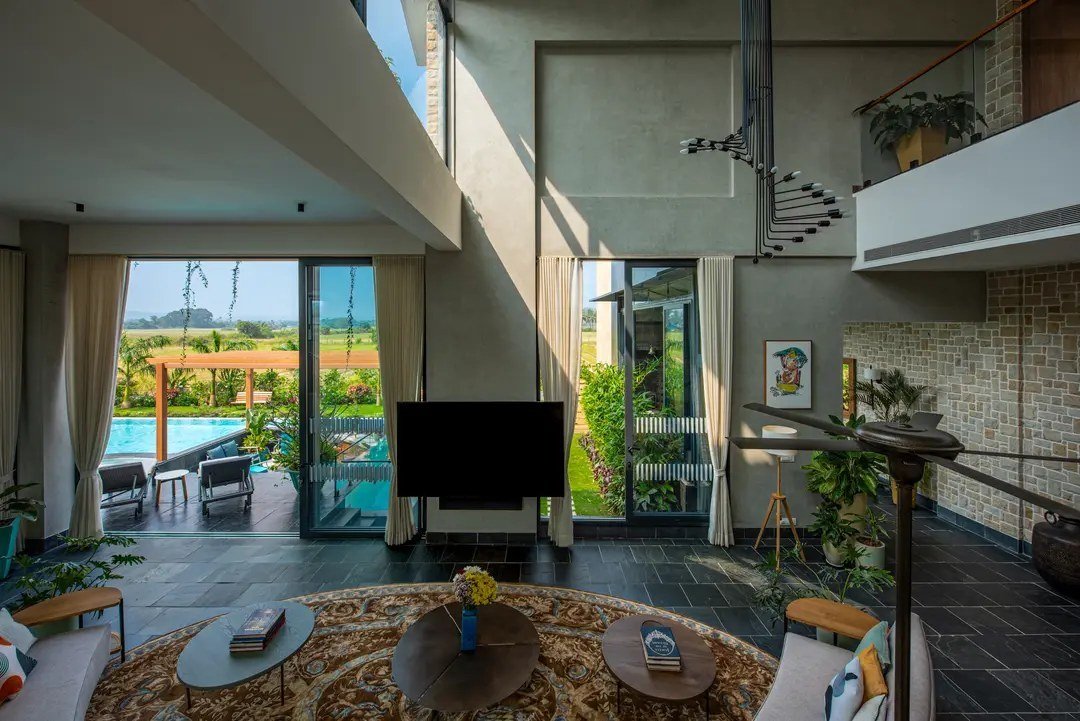 Living area in a Goa villa with a 100-inch TV and Bang and Olufsen soundbar