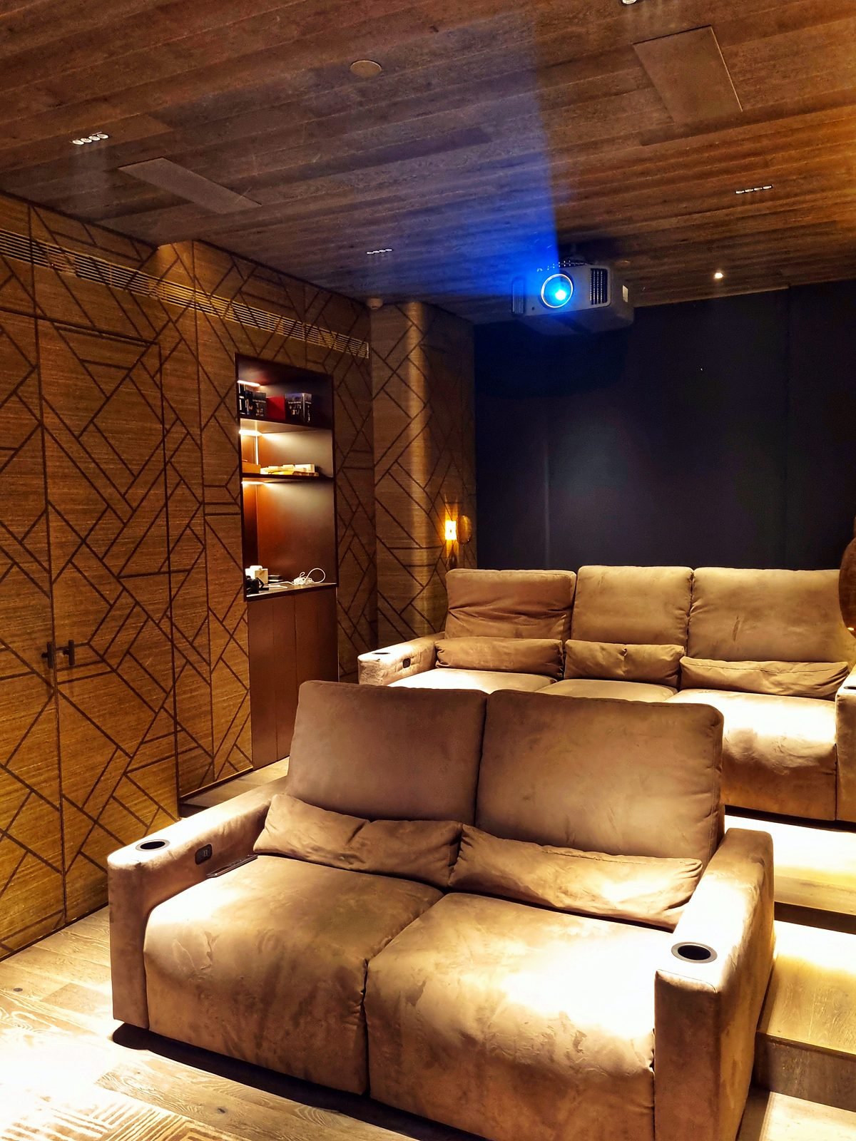 Home theatre seating and wall panelling in a Lower Parel apartment