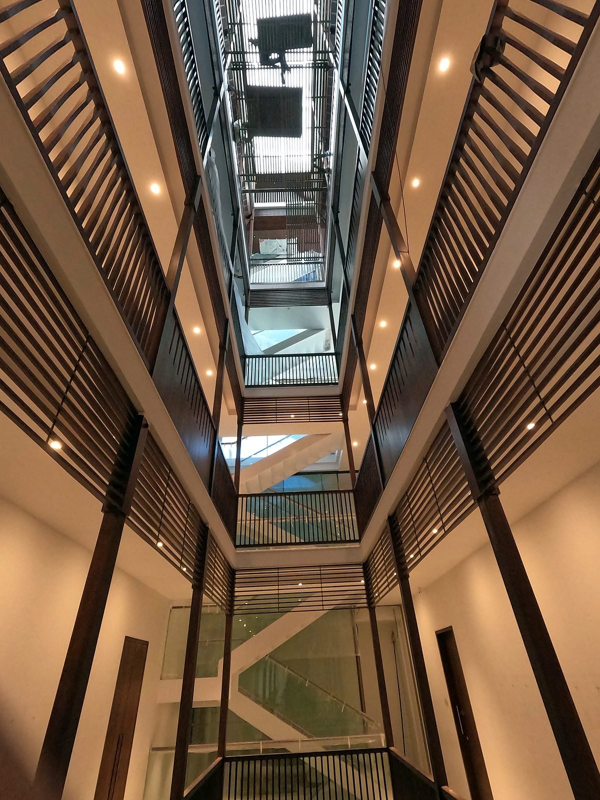 Looking up the central stairwell of a six-storey smart mansion in Nagpur
