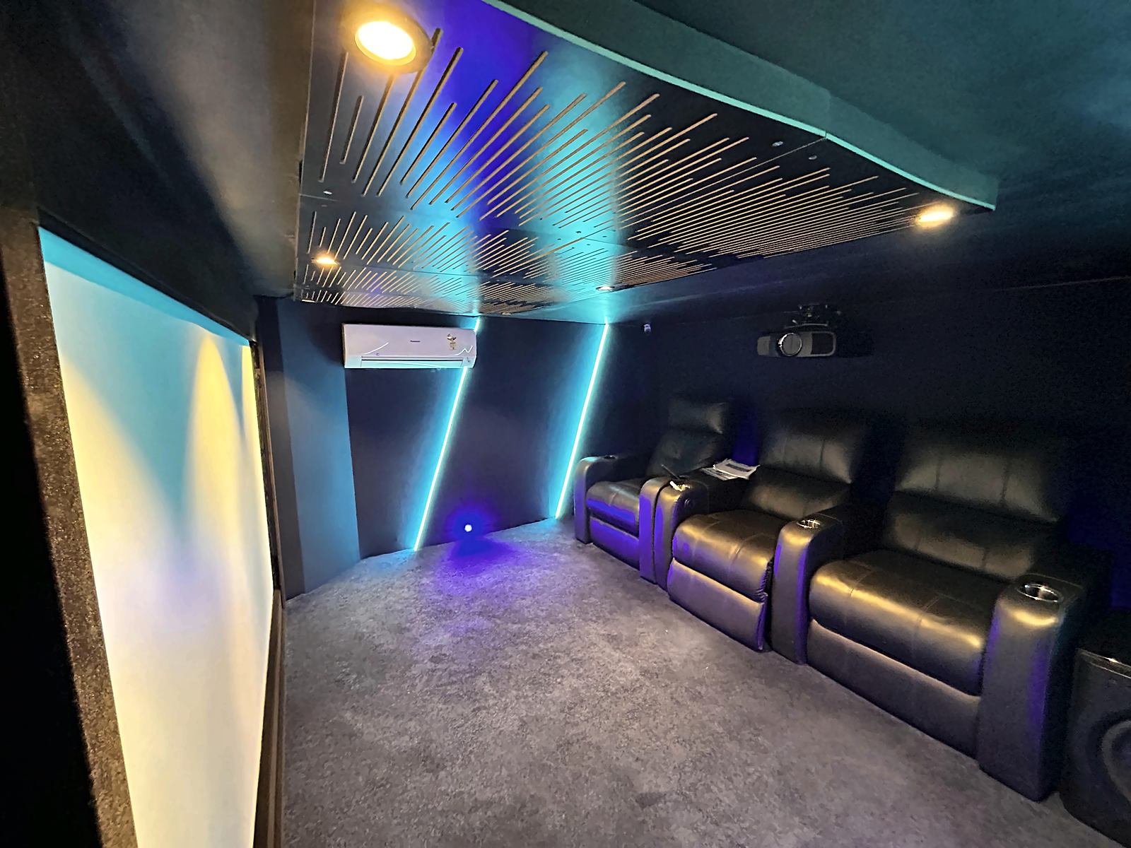 Dedicated 5.2 home theatre demo room with recliners and projection screen at Avenue Sound Seawoods, Navi Mumbai