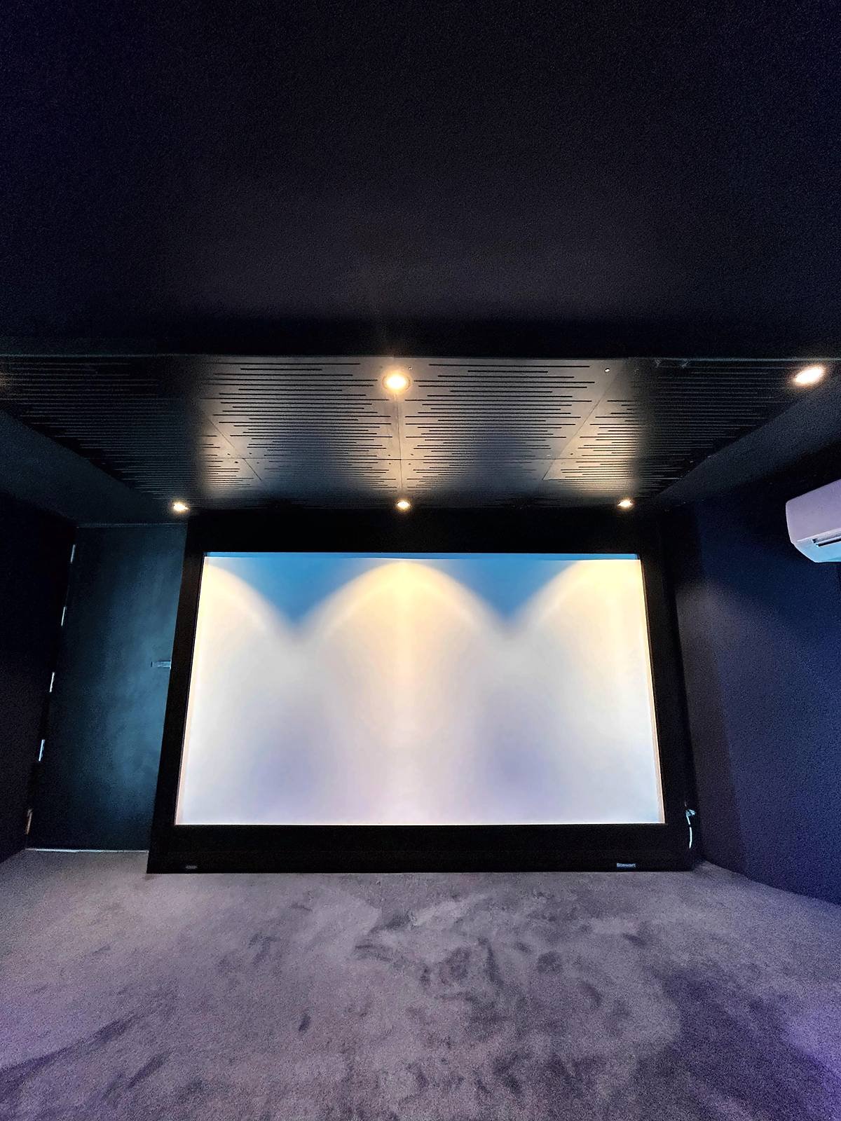 Projection screen in the Avenue Sound Navi Mumbai home theatre demo room