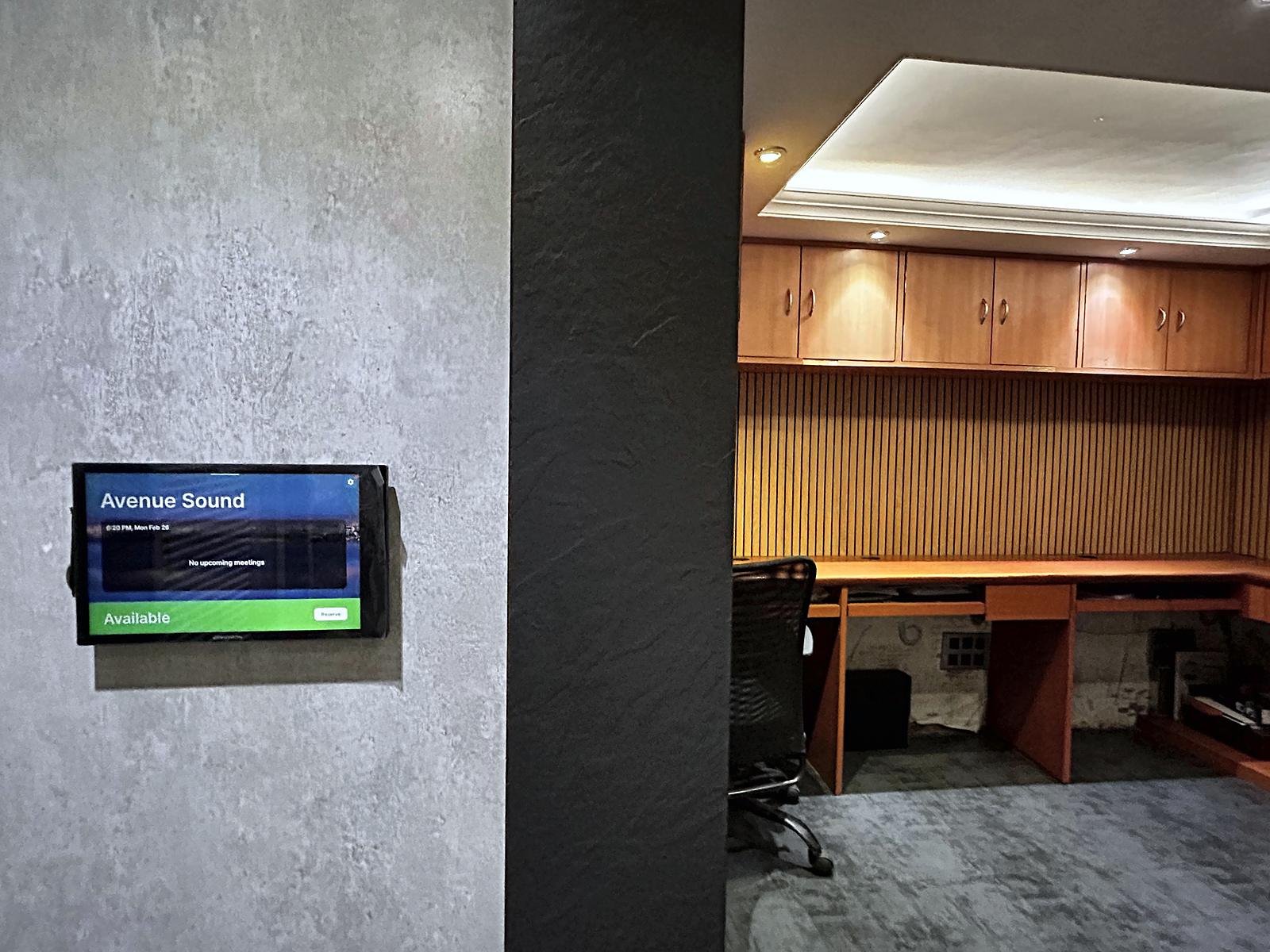 Wall-mounted smart control panel at Avenue Sound Seawoods